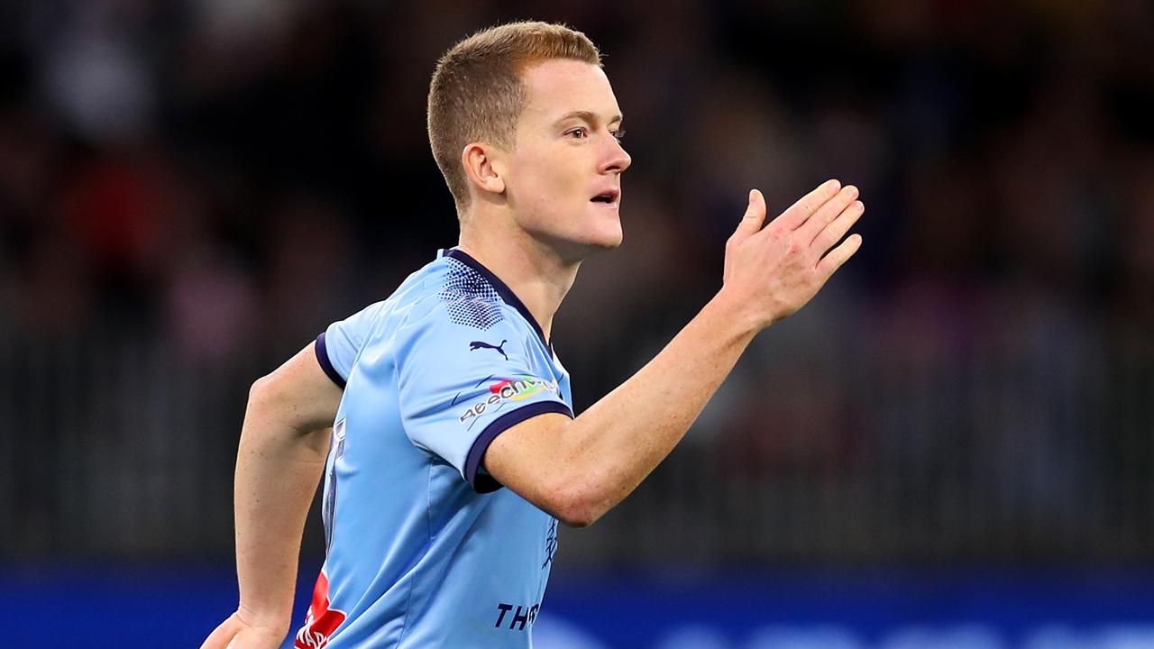 Brandon O'Neill celebrates slotting a penalty in the A-League grand final shootout.