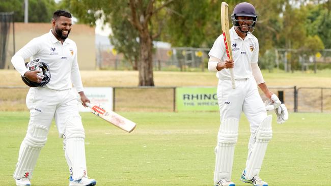 Thaveesh Attanayake and Jonathan Vincent of Kingston Hawthorn walk off after the victory on Saturday. Picture: George Sal