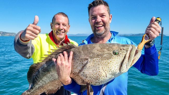 Warren Rowe let son-in-law Daniel Coleman heave his big gold spot cod for a pic before giving the fish its freedom