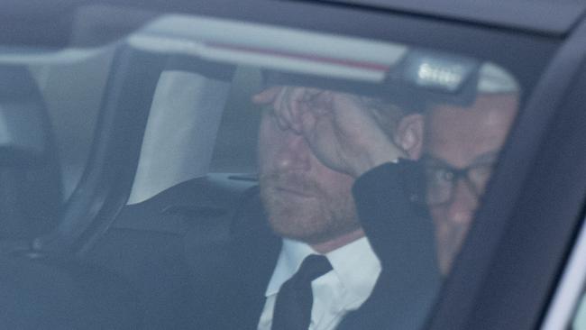 Prince Harry wipes his eyes while en route to Balmoral. Picture: GoffPhotos.com/Australscope