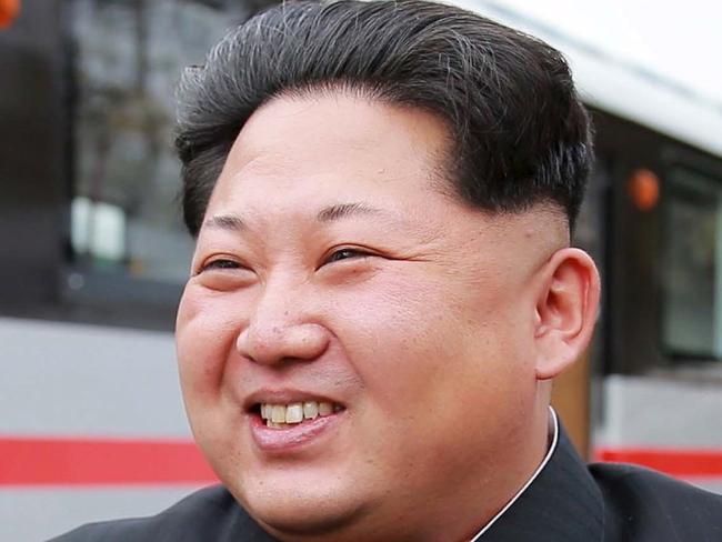 North Korean leader Kim Jong Un smiles as he looks at a newly manufactured metro train during a visit to the Kim Jong Thae Electric Locomotive Complex in this undated photo released by North Korea's Korean Central News Agency (KCNA) in Pyongyang October 23, 2015. Picture released October 23, 2015. REUTERS/KCNA ATTENTION EDITORS - THIS PICTURE WAS PROVIDED BY A THIRD PARTY. REUTERS IS UNABLE TO INDEPENDENTLY VERIFY THE AUTHENTICITY, CONTENT, LOCATION OR DATE OF THIS IMAGE. FOR EDITORIAL USE ONLY. NOT FOR SALE FOR MARKETING OR ADVERTISING CAMPAIGNS. THIS PICTURE IS DISTRIBUTED EXACTLY AS RECEIVED BY REUTERS, AS A SERVICE TO CLIENTS. NO THIRD PARTY SALES. SOUTH KOREA OUT. NO COMMERCIAL OR EDITORIAL SALES IN SOUTH KOREA.