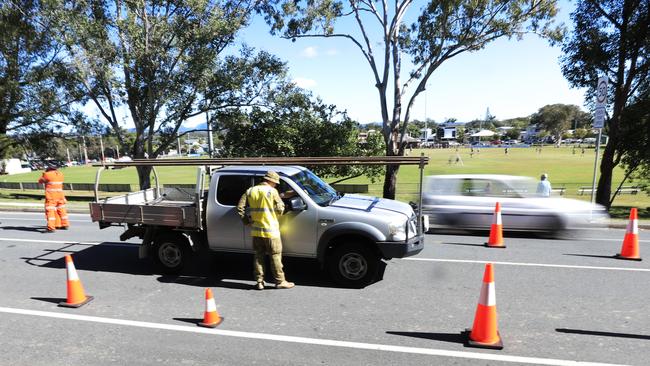 The Australian Army assist Queensland Police at the Miles Street Border crossing in Coolangatta, checking vehicles entering Queensland. Photo: Scott Powick