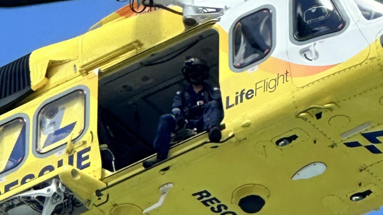 WATCH: Man winched by helicopter after falling 20m off cliff at Noosa