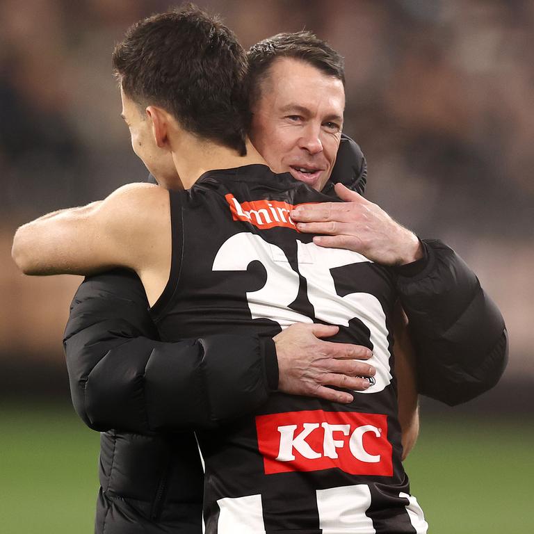 Pies coach Craig McRae embraces Nick Daicos. Picture: Michael Klein.