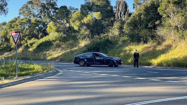 Police blocked the roadway just past intersection of the Old Bruce Hwy and Sankeys Rd following a serious two-car crash at Federal. Picture: Scott Kovacevic