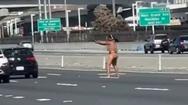 A driver got out of her car naked and started firing a gun Tuesday on the San Francisco–Oakland Bay Bridge, the California Highway Patrol said. Picture: KPIX-TV