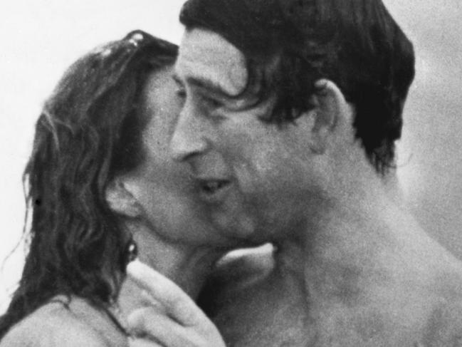 Prince Charles is kissed by Jane Priest, a model, as he emerges from the water at Cottesloe beach in Perth, during his 1979 tour of Australia. (Photo by ÃÂ© Hulton-Deutsch Collection/CORBIS/Corbis via Getty Images)