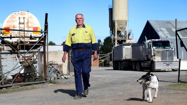 Cement maker Marco Revelant with his dog Chocolate. Picture: Jane Dempster