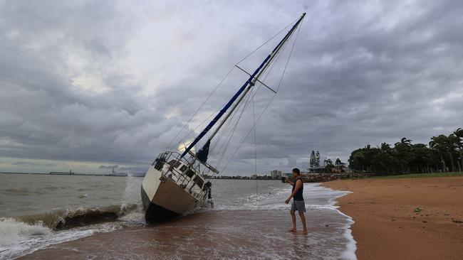 Townsville locals including Dr Deepak Doshi woke early to inspect the damage along The Strand left from TC Kirrily that hit overnight. Picture: Adam Head
