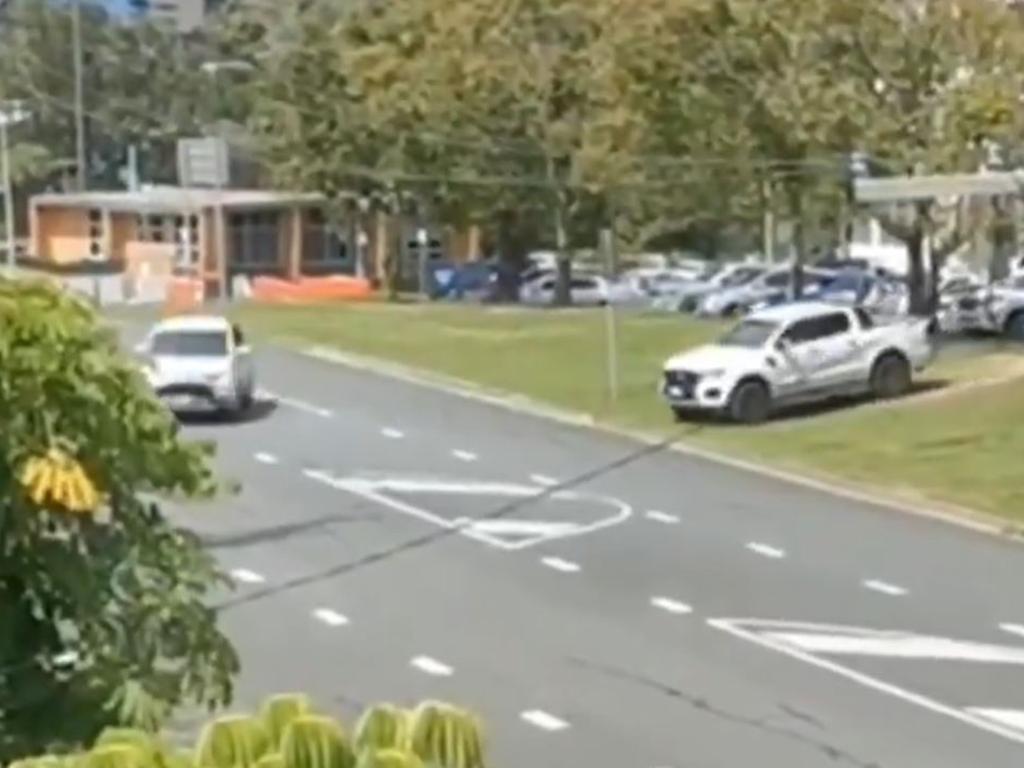 A ute makes the daring dash down an median strip embankment from Thomson St, Tweed Heads, onto Dixon St, Coolangatta, where police are absent. Picture: Channel 9