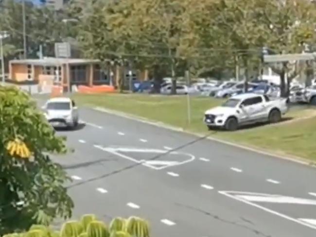 A ute makes the daring dash down an median strip embankment from Thomson St, Tweed Heads, onto Dixon St, Coolangatta, where police are absent. Picture: Channel 9