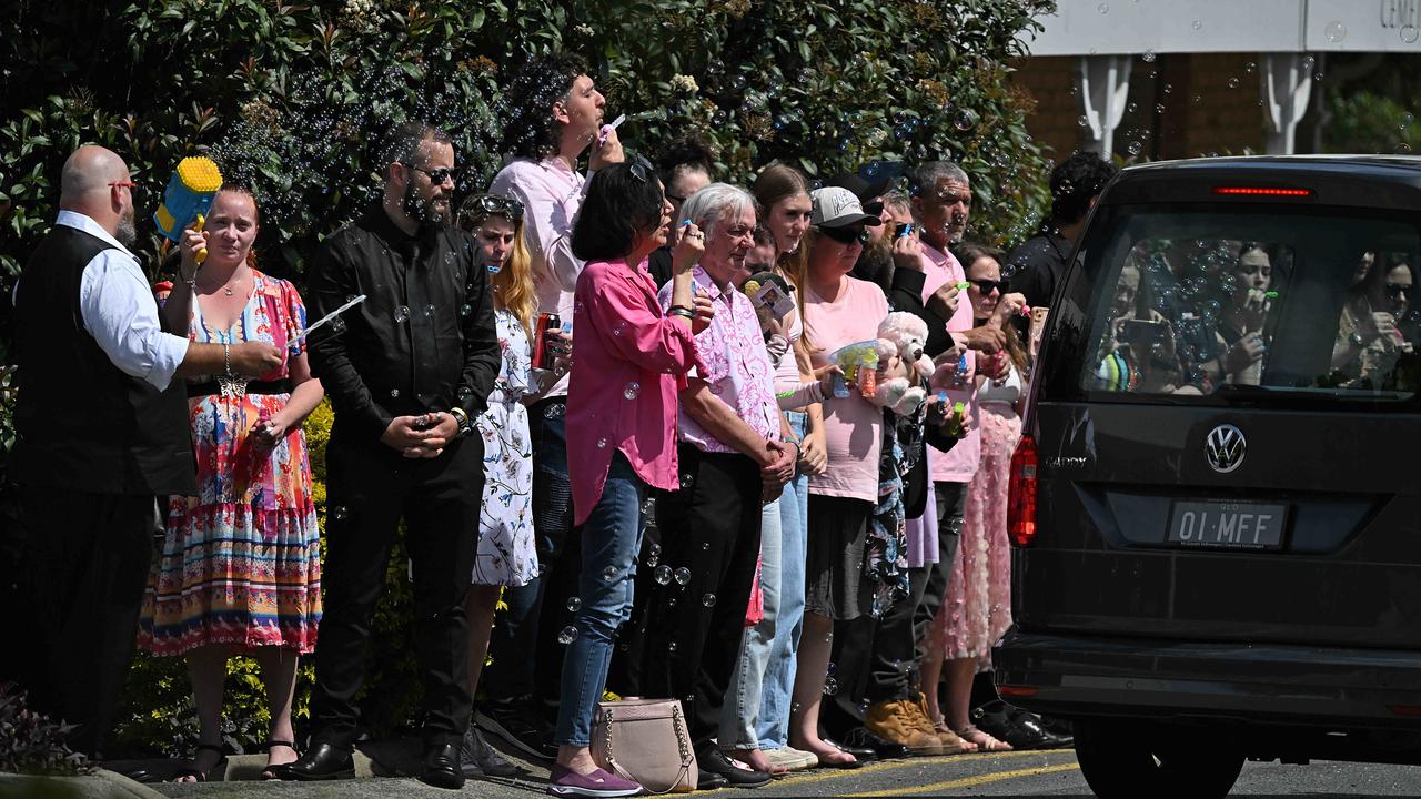 Family and friends, including mother Chloe Rodgers-Falk and stepdad Matthew Rodgers-Falk, attend the funeral for Raven Kaye Contini 8.