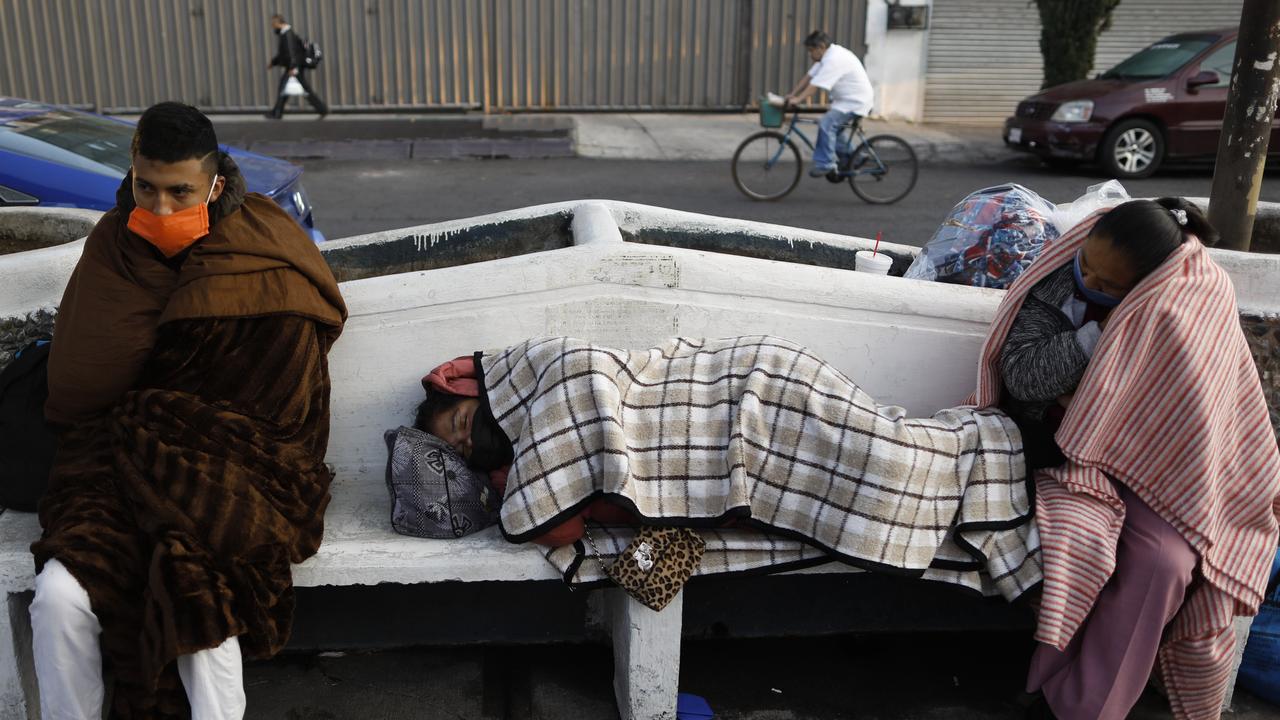 People sleep outside as they wait for relatives in the Mexico General Hospital in Mexico City. Picture: Rebecca Blackwell/AP