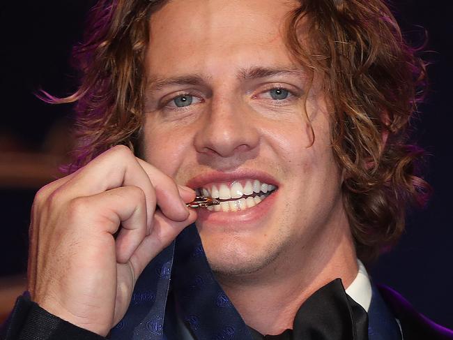 Brownlow Medal at Crown Casino, Melbourne. 23/09/2019.   Winner fremantles Nat Fyfe bites the Brownlow Medal   . Pic: Michael Klein.