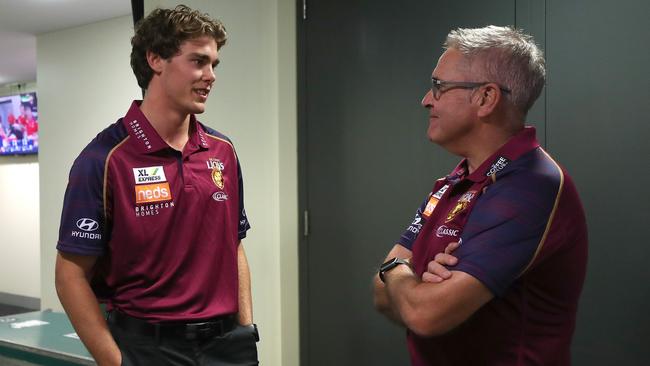 Brisbane’s top draft pick Deven Robertson meets senior coach Chris Fagan.