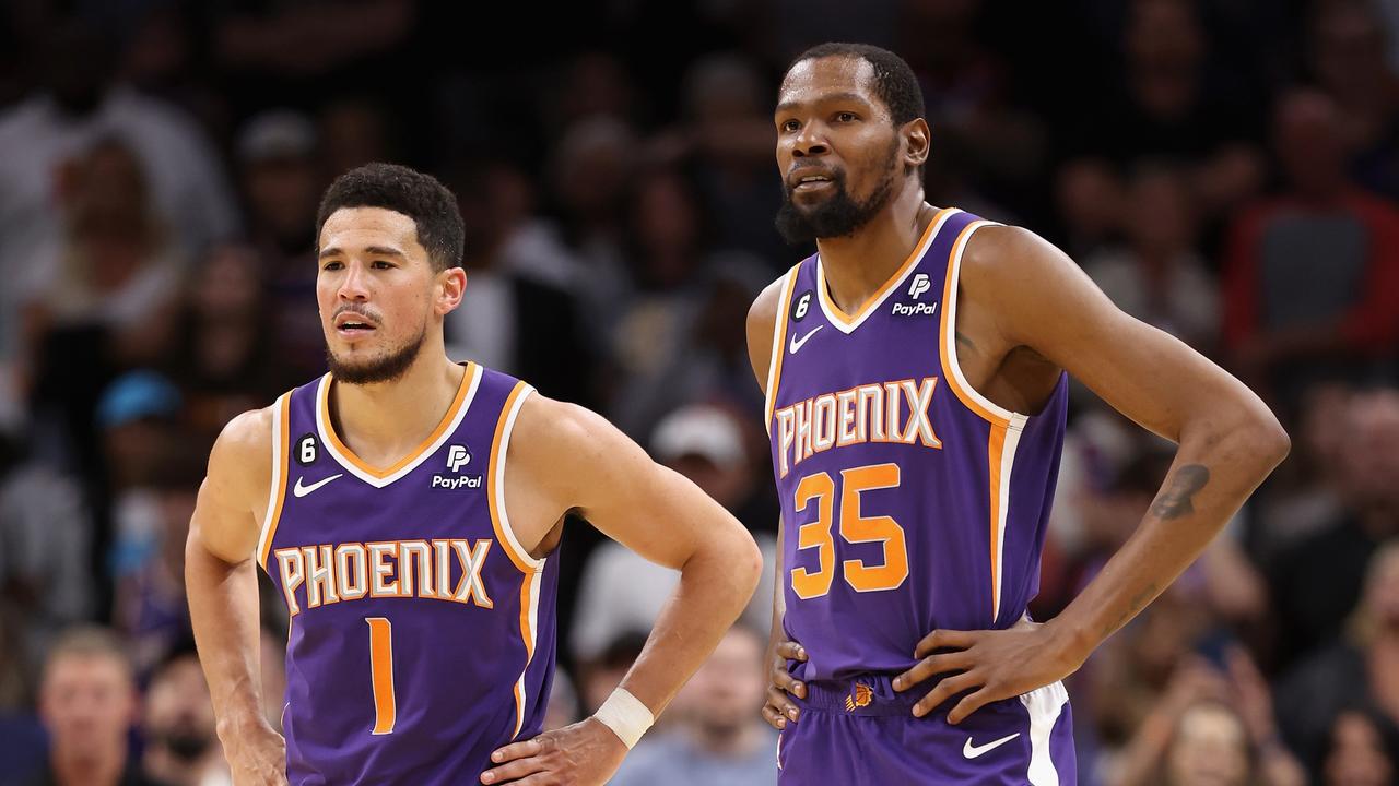 Devin Booker and Kevin Durant have a third wheel. Photo by Christian Petersen/Getty Images.