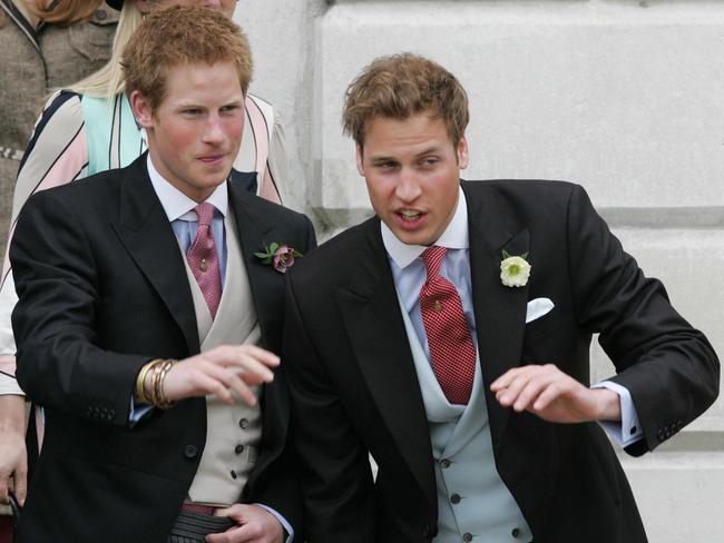 APRIL 9, 2005: Britain's Prince William (R) and Prince Harry, sons of Prince Charles, wave after their father's civil wedding ceremony to Camilla Parker Bowles, outside the Guildhall in Windsor, southern England, 09/04/05. Royals / Family