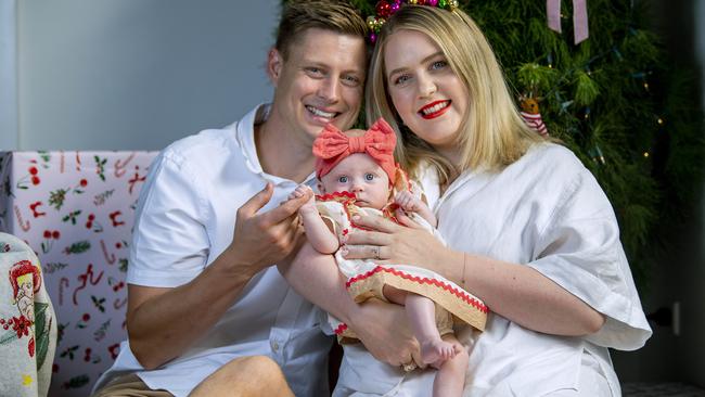 Hannah and Simon Potts with cutest spring baby winner Poppy 3 months in front of their Christmas tree at their Klemzig home .Thursday December,19,2025.Picture Mark Brake