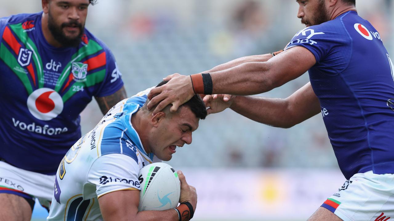 GOSFORD, AUSTRALIA - MARCH 13: David Fifita of the Titans is tackled by Peta Hiku during the round one NRL match between the New Zealand Warriors and the Gold Coast Titans at Central Coast Stadium, on March 13, 2021, in Gosford, Australia. (Photo by Ashley Feder/Getty Images)