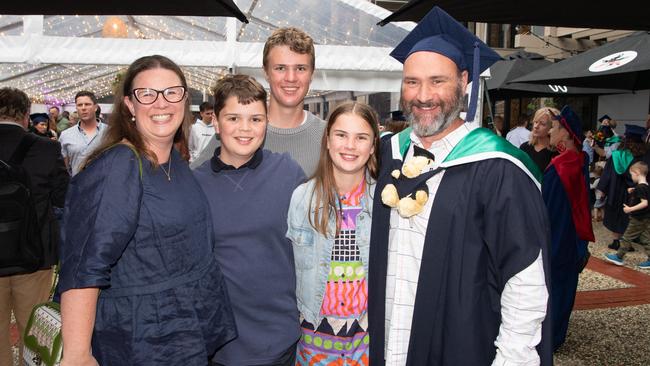 03-10-2023 Deakin University education graduations at the waterfront campus. Kate and Shane Jackson with kids Finn, Ali and Patrick
