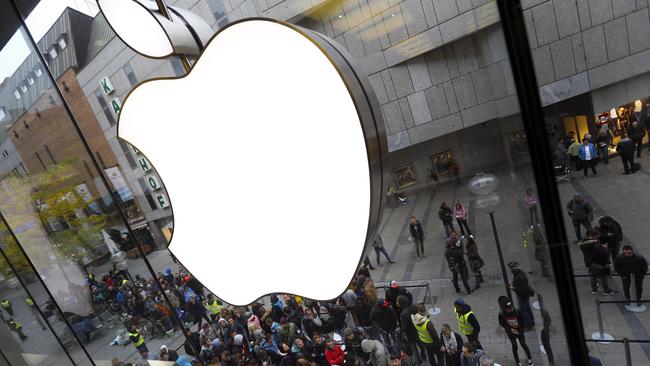 The biggest challenge for the likes of Apple and Samsung is to convince customers to ditch their existing devices and upgrade. Picture: AP/Matthias Schrader.
