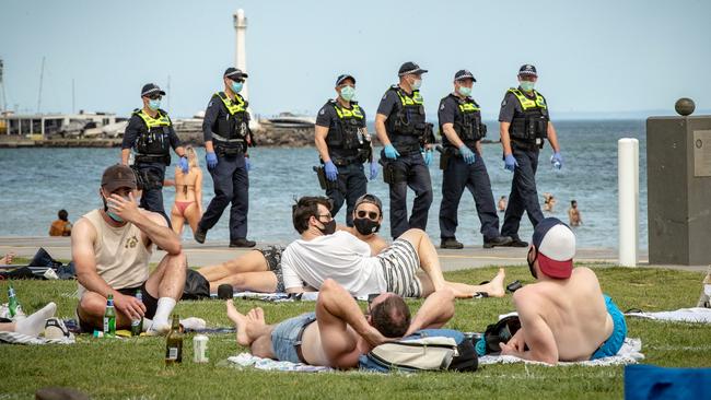 Police patrolling St Kilda beach in October last year. Picture: Darrian Traynor