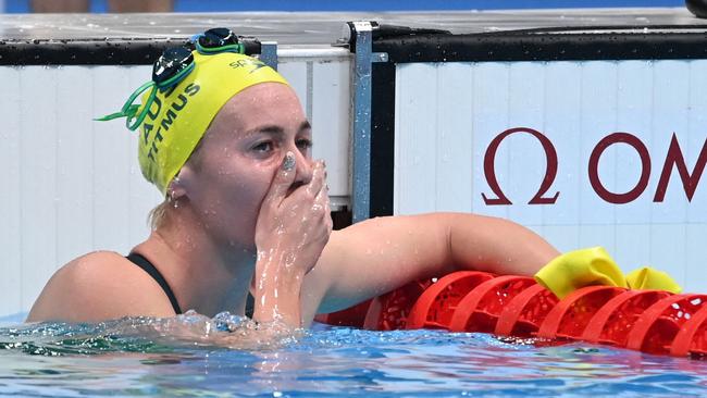 Australia's Ariarne Titmus reacts after taking gold in the final of the women's 400m freestyle swimming event during the Tokyo 2020 Olympic Games at the Tokyo Aquatics Centre in Tokyo on July 26, 2021. (Photo by Jonathan NACKSTRAND / AFP)