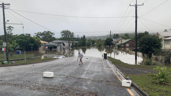 Elwyn Paddison, 80, surveys flood damage to his home at the intersection of Hunter Street and McKenzie Street in Lismore on March 1, 2022.