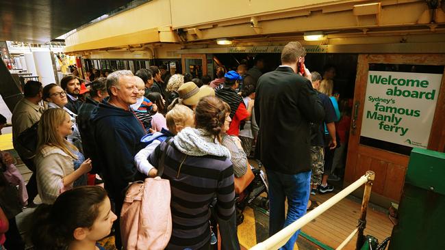 Crowds of people line up to catch the Manly Ferry at Circular Quay. Picture: Toby Zerna