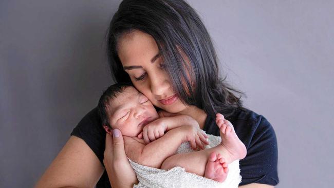 Rachel and Shea Edwards with their daughter Mia. Mia has a rare brain condition that comes with a life expectancy of 7 to ten years. Picture: Sue Louise Photography