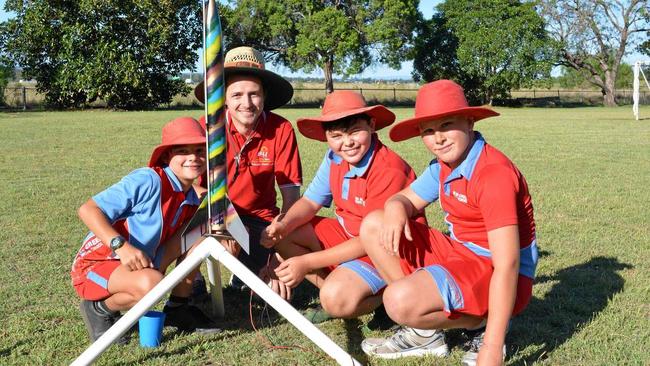 BLAST OFF: Ma Ma Creek chaplain Tim Ormiston prepares to launch rockets with students to mark the implementation of Positive Learning Program. Picture: Francis Witsenhusyen