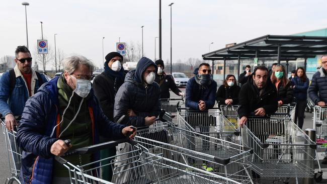 Residents wait to be access a supermarket in the small Italian town of Casalpusterlengo due to fears of a coronavirus pandemic. Picture: Miguel Medina/AFP