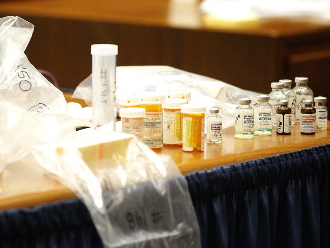 Drugs found in the home of pop star Michael Jackson by Los Angeles County coroner investigator Elissa Fleak sit on the prosecutions table after being introduced as evidence during Conrad Murray's trial. Picture: Mario Anzuoni
