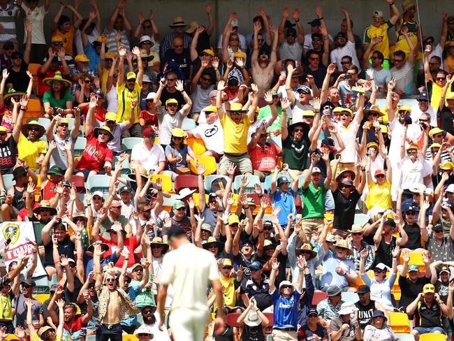 The crowd do the Mexican wave at the Ashes First Test at the Gabba last year.