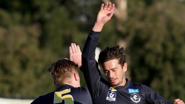 NFL players Ned McKeown and Justin White celebrate a goal. Picture: Mark Wilson.