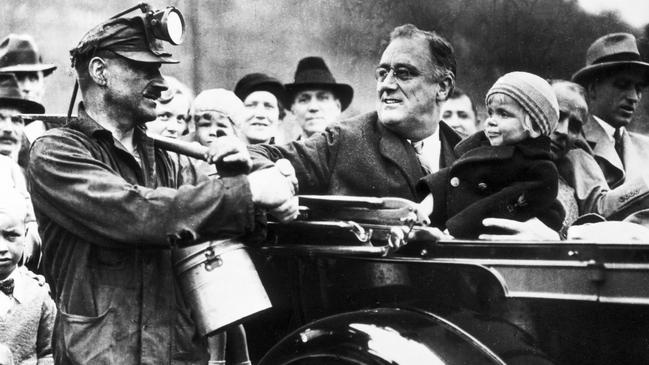 Franklin D Roosevelt greets a miner during the Depression 1929-1934. b&amp;w