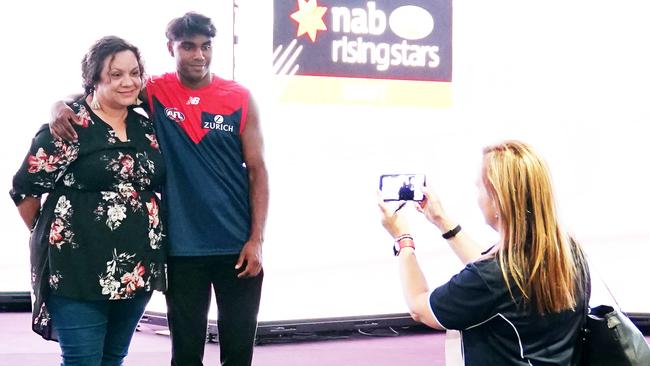 Kysaiah Pickett is seen posing with his mum during the first round of the 2019 AFL Draft at Marvel Stadium. Picture: Michael Dodge/AAP