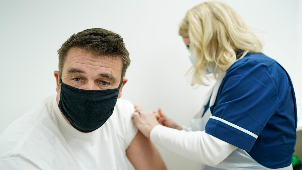 A man is given the AstraZeneca/Oxford University COVID-19 vaccine in Middlesbrough, England.