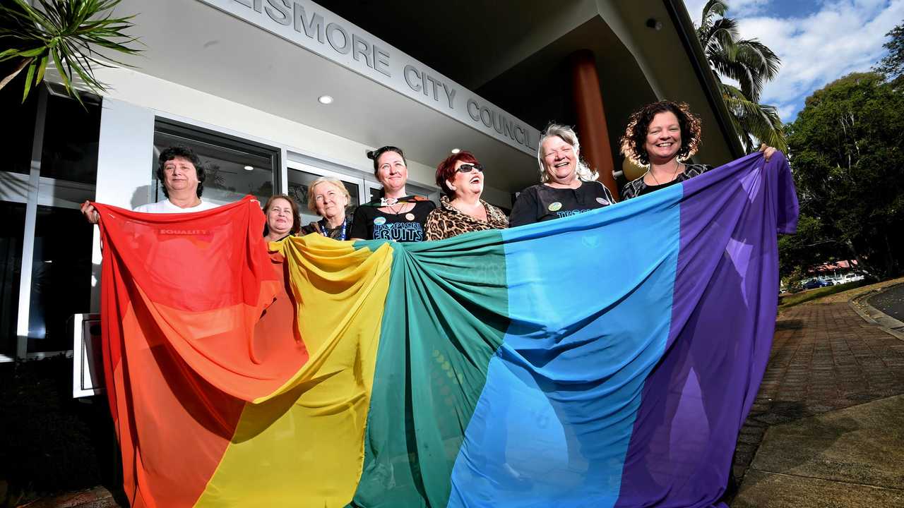 COUNCILLORS Darlene Cook and Elly Bird were on hand with supporters to raise a rainbow flag outside council chambers. Picture: Marc Stapelberg