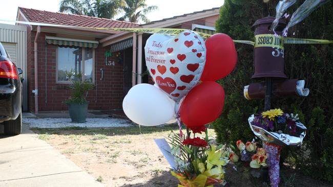 Tributes left at the home of Beverley Hanley following her murder.