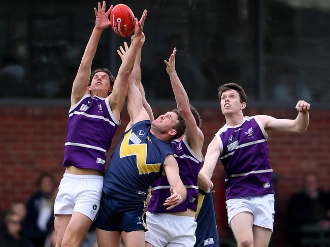 Brunswick NOBS and Whitefriars players compete for the mark during the Division 2 grand final. Picture: Andy Brownbill