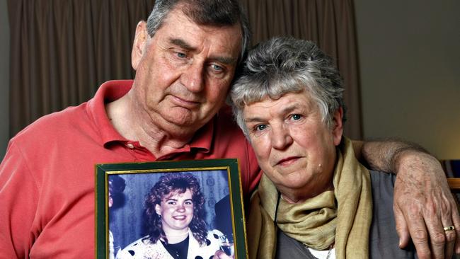 Peter and Sheila MacDiarmid with a picture of their daughter, Sarah, who is presumed to have been murdered in 1990.