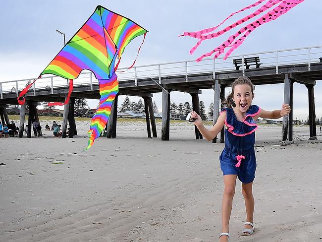 Chanel Maio, 7, and her sister Chelsea Maio ,11, test run kites Rainbow Delta and Jellyfish from Free as a Bird Kites at Grange Beach Wednesday January 13,2021.Picture Mark Brake