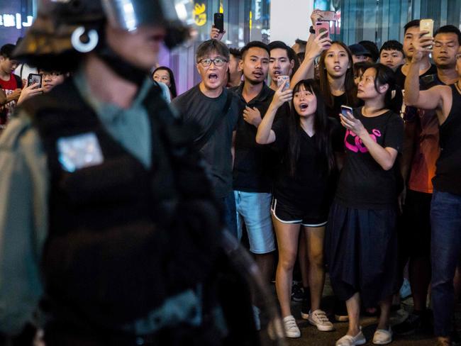 Pedestrians yell at police during a clearance operation against anti-government protesters in the Yau Ma Tei district of Hong Kong. Picture: AFP