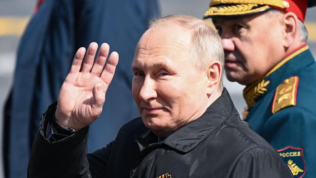 Russian President Vladimir Putin and Defence Minister Sergei Shoigu leave Red Square after the Victory Day military parade. Picture: AFP
