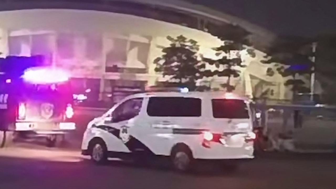 Emergency vehicles arriving after a driver ploughed through a crowd of people exercising at a sports centre in Zhuhai, in south China's Guangdong province. (Photo by UGC / AFP).