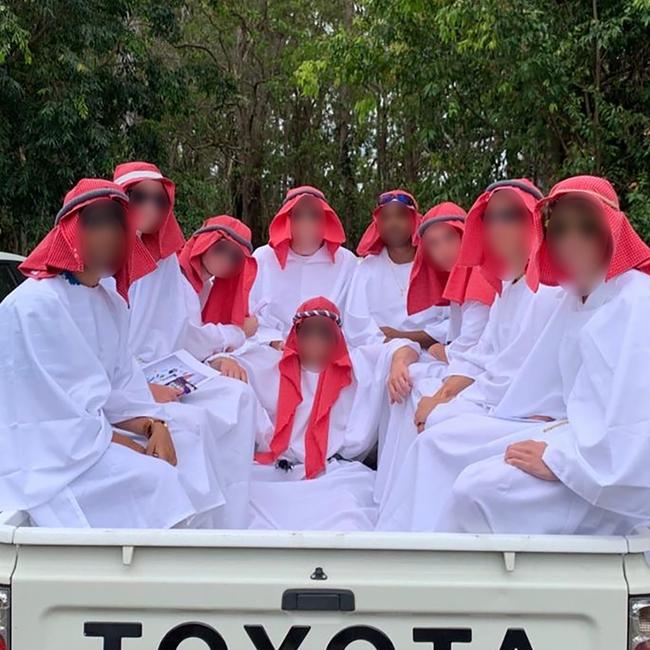 Nine of the Year 12 students who dressed as “Saudi Arabian Princes” for Muck Up Day at Murrumba State Secondary College. Supplied.