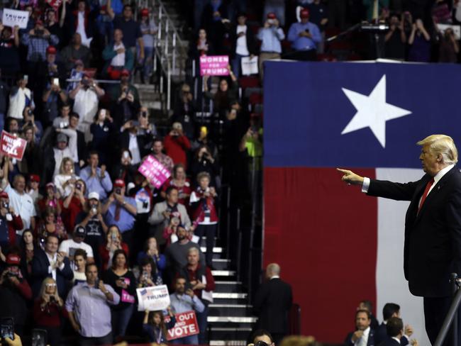 President Donald Trump points into the crowd during a campaign rally for Sen. Ted Cruz, R-Texas, at Houston Toyota Center, Monday, Oct. 22, 2018, in Houston. (AP Photo/Evan Vucci)