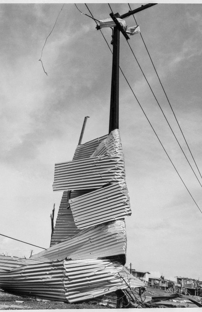 Corrugated iron wrapped around a power pole after Cyclone Tracy. Supplied/MAGNT