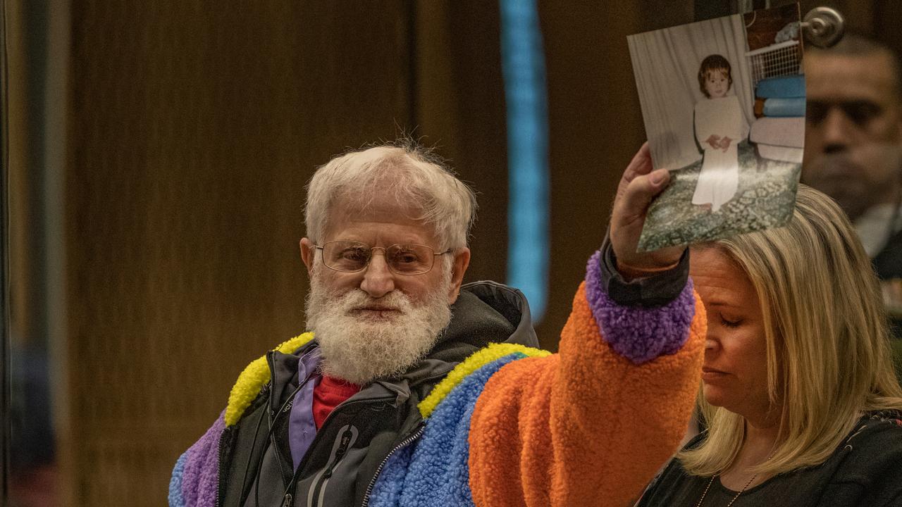 John Milne holds a photograph of his son, Sayyad Milne. Picture: John Kirk-Anderson/Pool/Getty Images